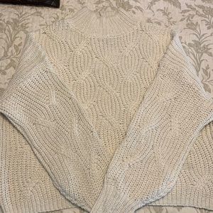 Cropped cable knit sweater